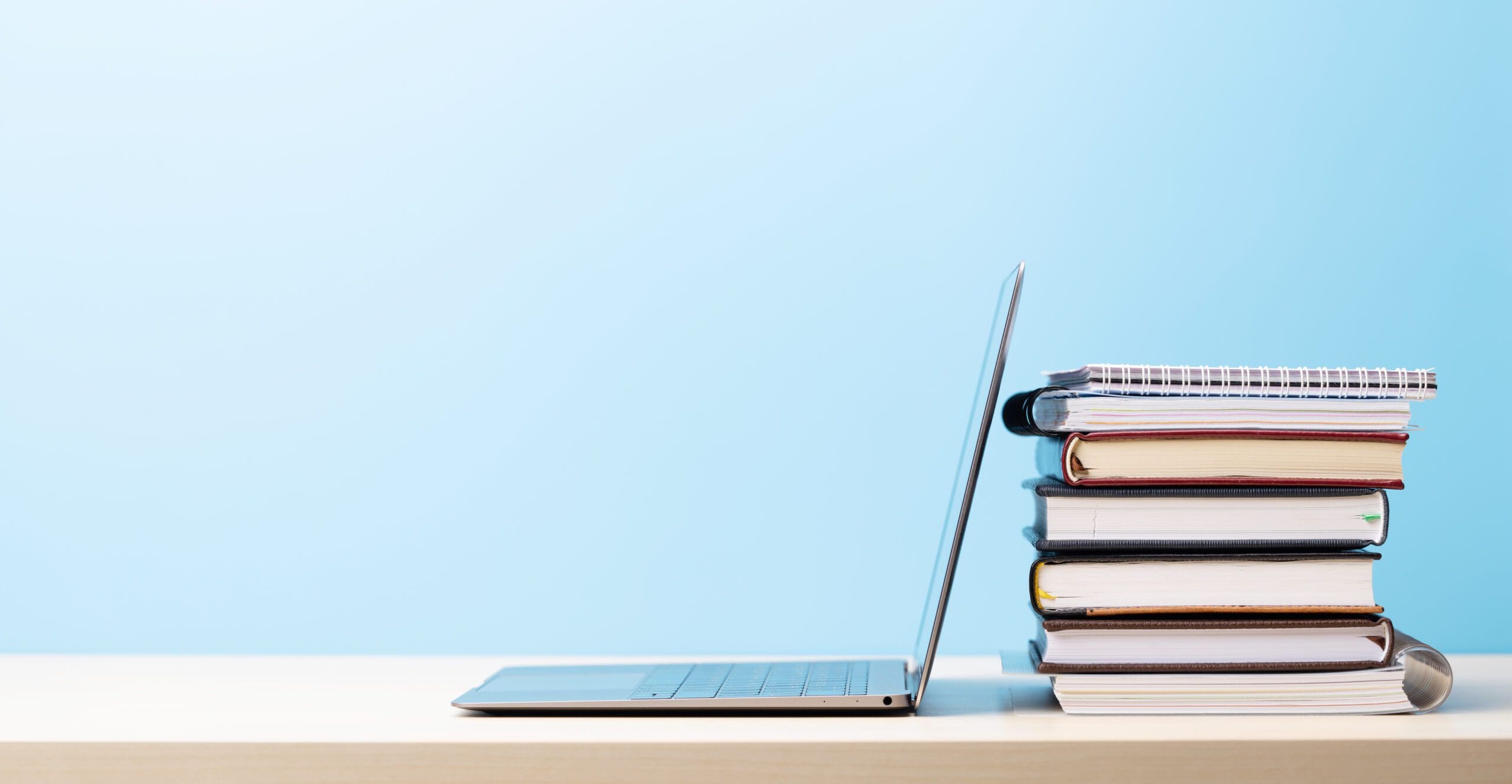 Laptop and stack of books