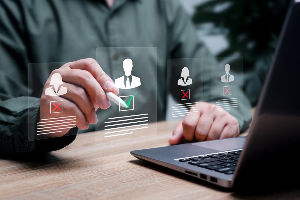 A man holding a stylus points at superimposed representations of clients.