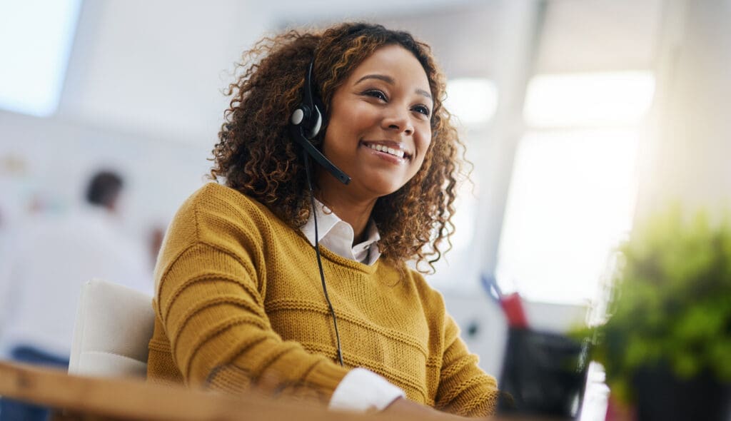 a woman making a call on a voip headset