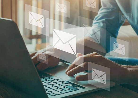 emailing on laptop
